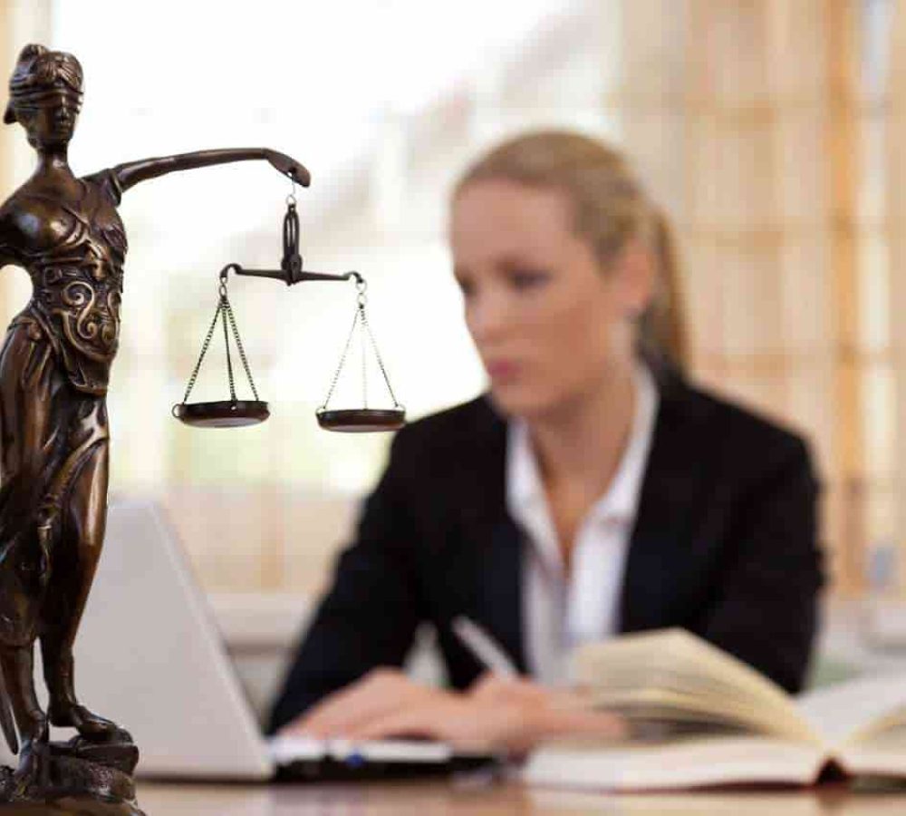 Statue-of-justice-with-lawyer-on-the-background